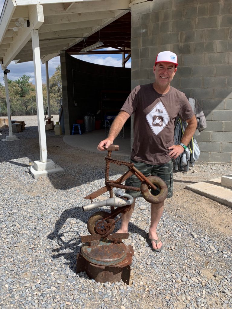 Jimmy next to a bike statue